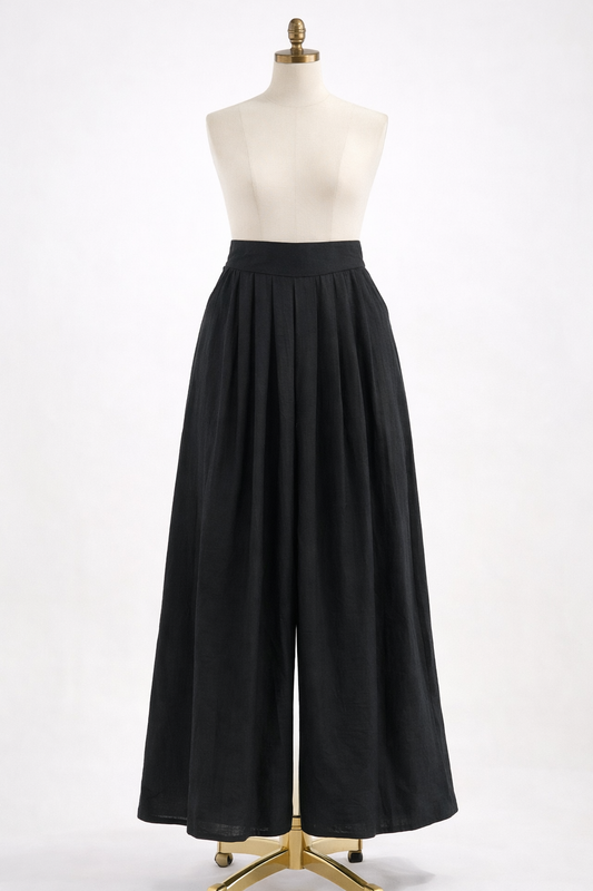 Black wide-leg pants on a mannequin against a white background