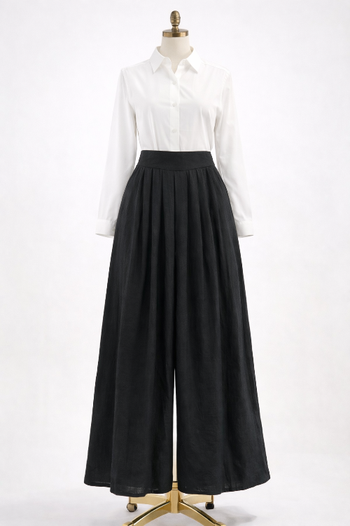 Mannequin wearing a white shirt and black wide-leg pants on a white background
