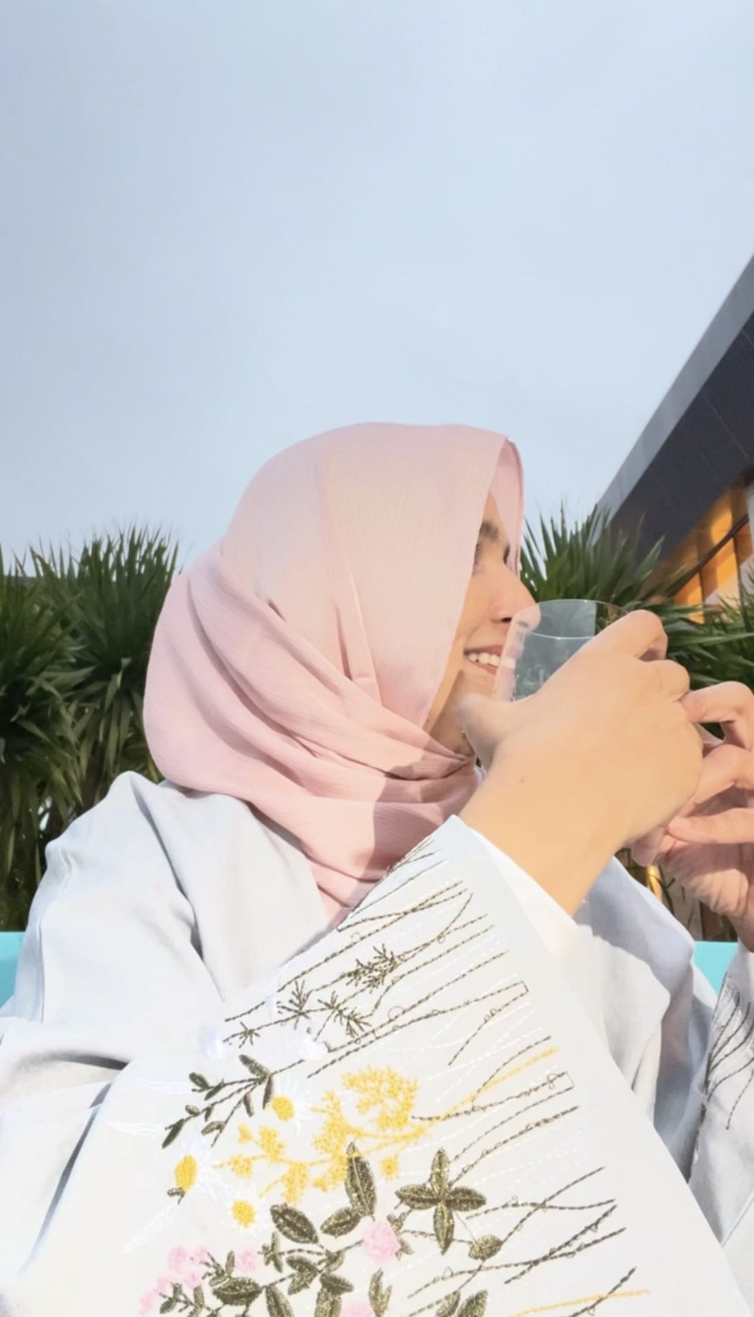 Woman wearing elegant modest fashion ensemble featuring layered clothing and contemporary styling, showcasing stylish modest wear for 2026