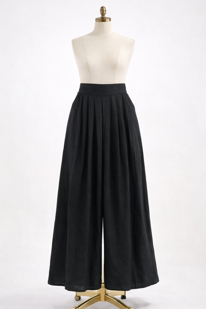 Black wide-leg pants on a mannequin against a white background