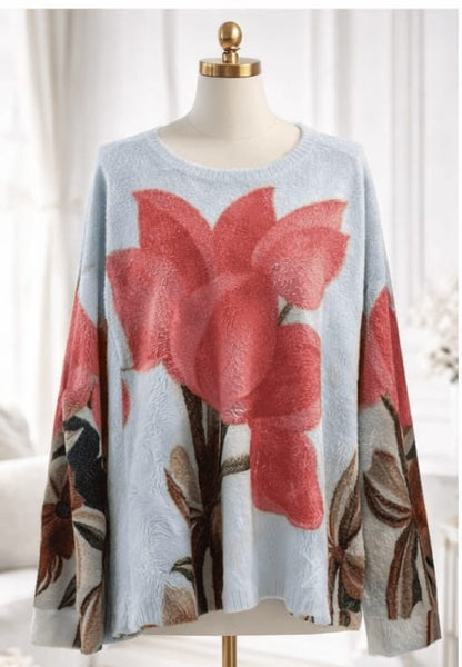 Floral-patterned sweater on a mannequin against a white background