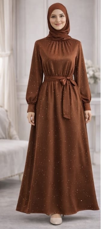 Woman wearing a brown dress with a matching hijab in an indoor setting