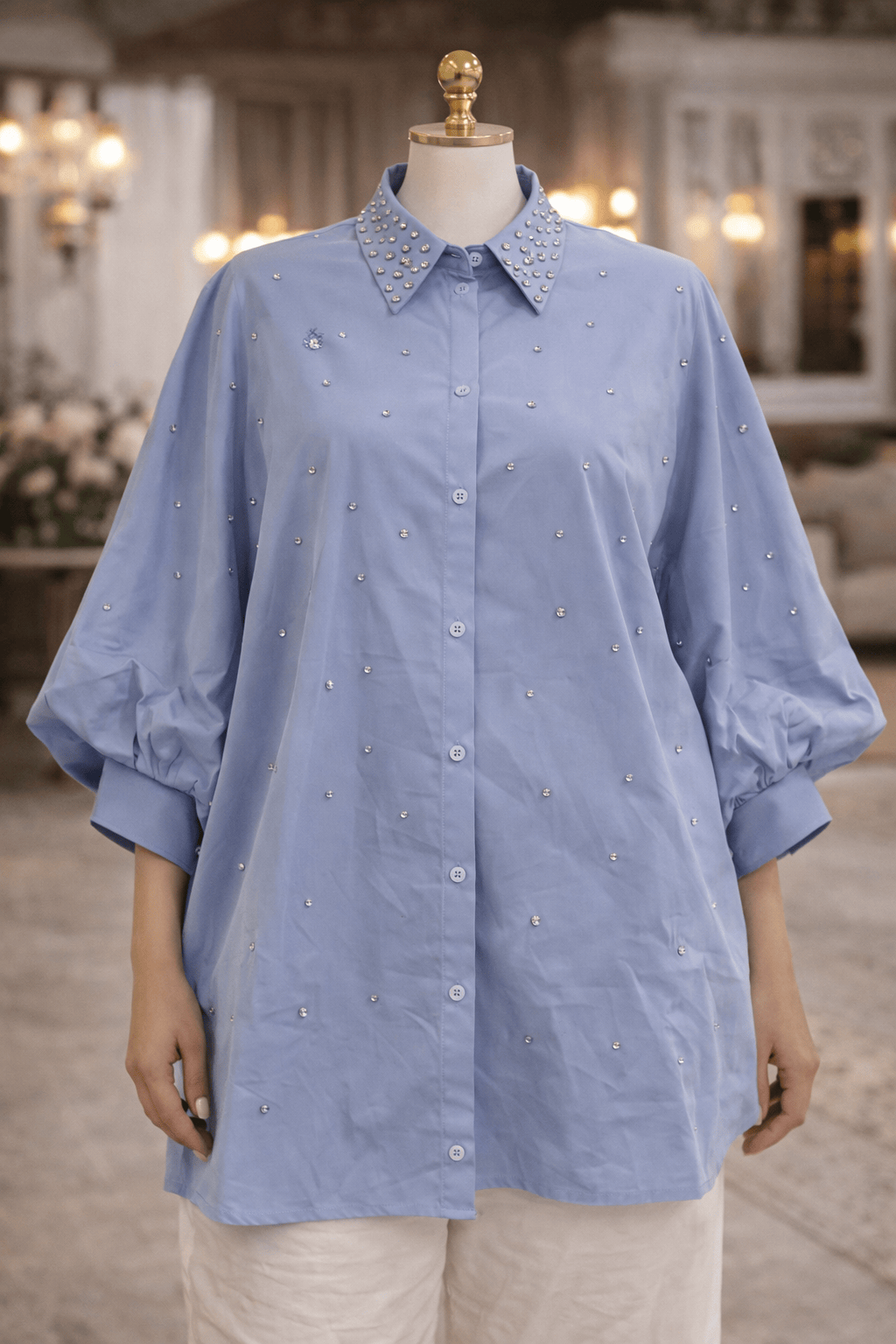 Blue shirt on a mannequin in an indoor setting