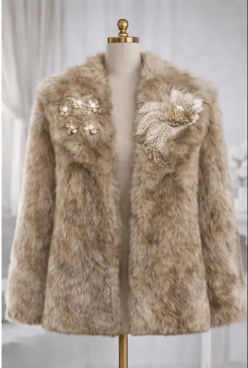 Beige fur coat with decorative brooches on a mannequin against a light background