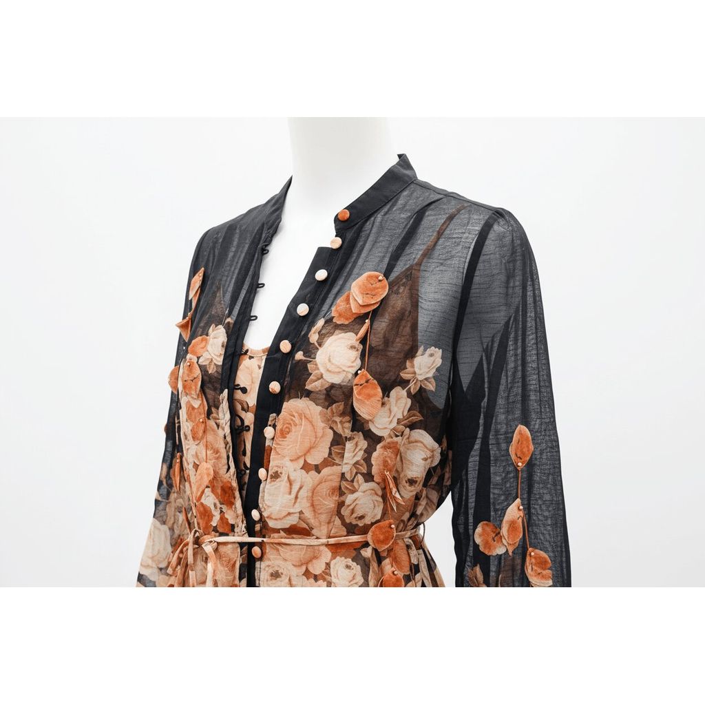 Mannequin wearing a floral patterned outfit with a sheer overlay on a white background