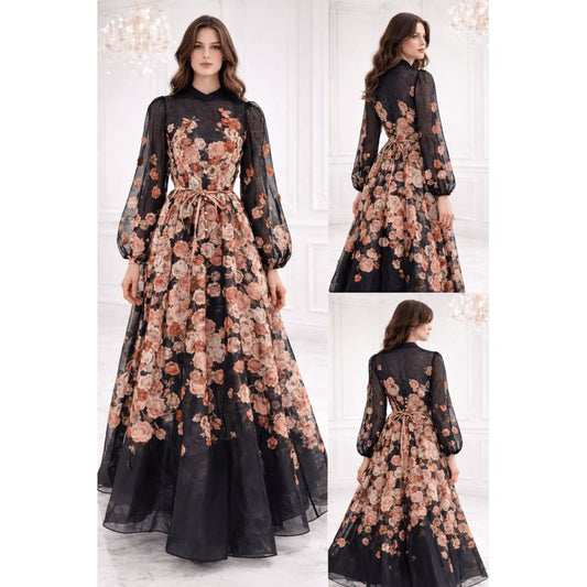 Long floral dress with a black base on a white background