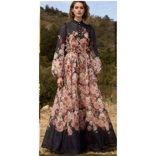 Woman wearing a floral dress with a mountainous background